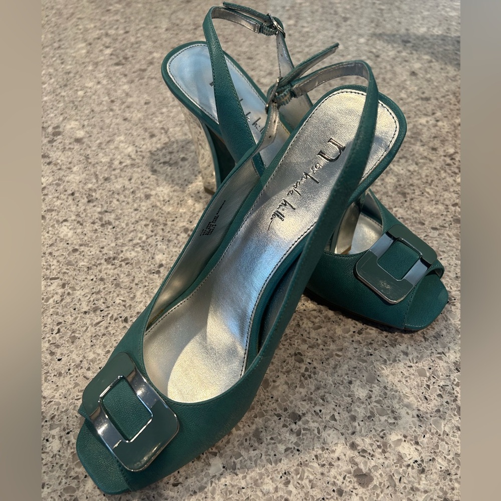 Seafoam slingbacks with silver heels and buckles